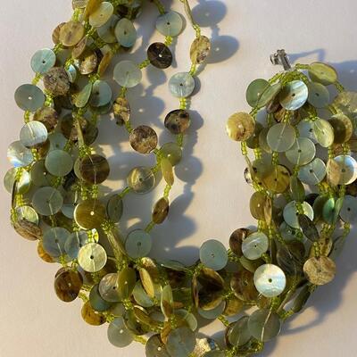 A mother of pearl button art house  necklace