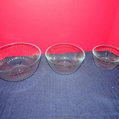 LOT 104. THREE GLASS PYREX BOWLS