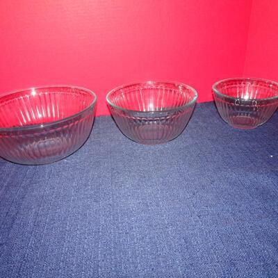 LOT 104. THREE GLASS PYREX BOWLS