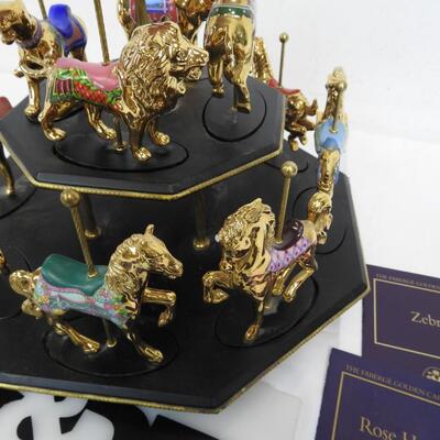 11 Pc Faberge Golden Carousel Includes 2 Tier Base. Some items are broken.