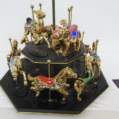 11 Pc Faberge Golden Carousel Includes 2 Tier Base. Some items are broken.