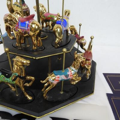 11 Pc Faberge Golden Carousel Includes 2 Tier Base. Some items are broken.