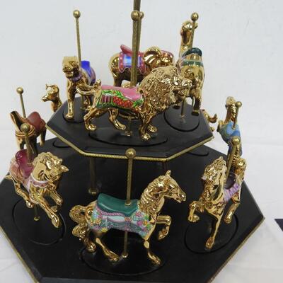 11 Pc Faberge Golden Carousel Includes 2 Tier Base. Some items are broken.