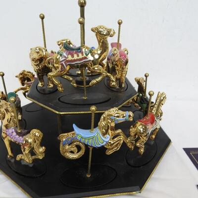 11 Pc Faberge Golden Carousel Includes 2 Tier Base. Some items are broken.
