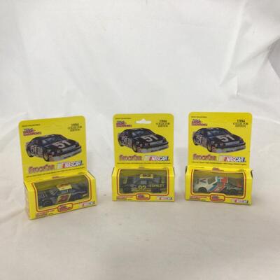 143) NASCAR | Richard Petty and Mixed Group of Racing Champion Figures