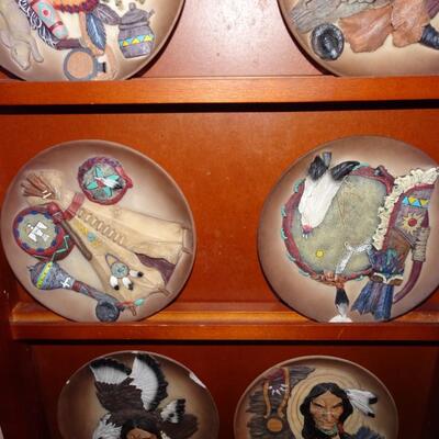 LOT 223.  NATIVE AMERICAN INSPIRED PLATES ON WALL RACK