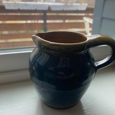 Two small clay pitchers