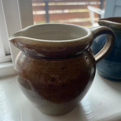 Two small clay pitchers