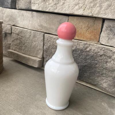 Vintage milk glass bottle with pink lid