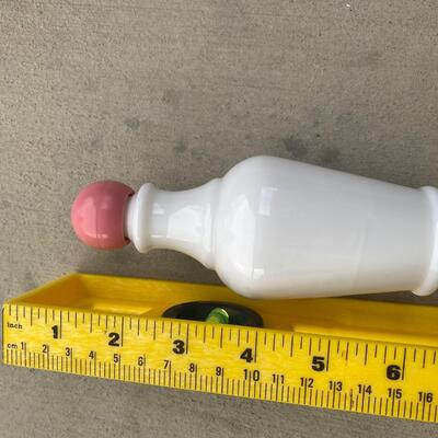 Vintage milk glass bottle with pink lid