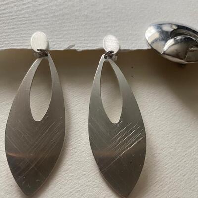 Two pair silver tone modern clip earrings