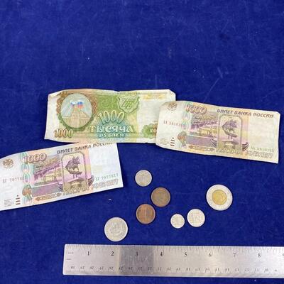 Lot of assorted foreign paper money and coins
