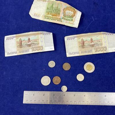 Lot of assorted foreign paper money and coins