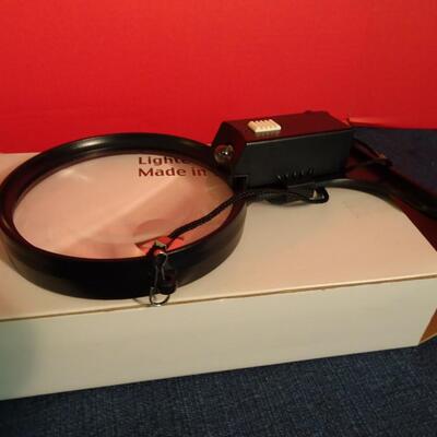 LOT 233. CYBER SHOT CAMERA AND MAGNIFYING GLASS