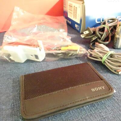 LOT 233. CYBER SHOT CAMERA AND MAGNIFYING GLASS