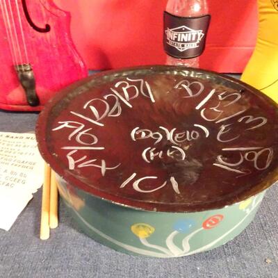 LOT 269. MUSIC RELATED HOME DECOR AND STEEL DRUM