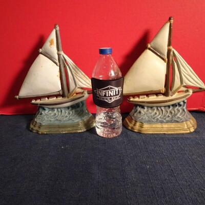 LOT 299. METAL SALE BOAT DOOR STOPS