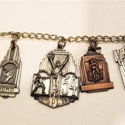 Lot #92  Bracelet with 7 vintage New Orleans Athletic Charms - 1950's