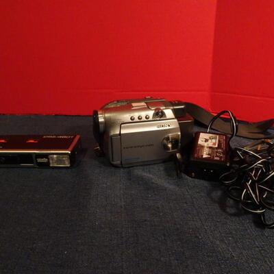 LOT 320. CAMERA AND VIDEO CAMERA