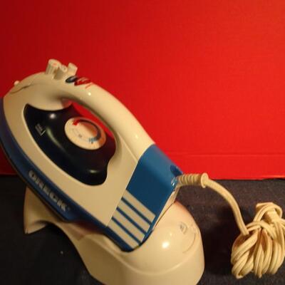 LOT 330. ORECK IRON AND STAND