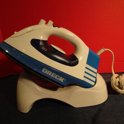 LOT 330. ORECK IRON AND STAND