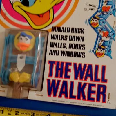 LOT 147  TWO DISNEY WALL WALKERS