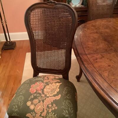 Dining room table, 6 caned chairs-2 are captains chairs