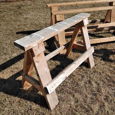 LOT 97 FOUR WOODEN SAWHORSES