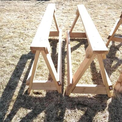 LOT 97 FOUR WOODEN SAWHORSES
