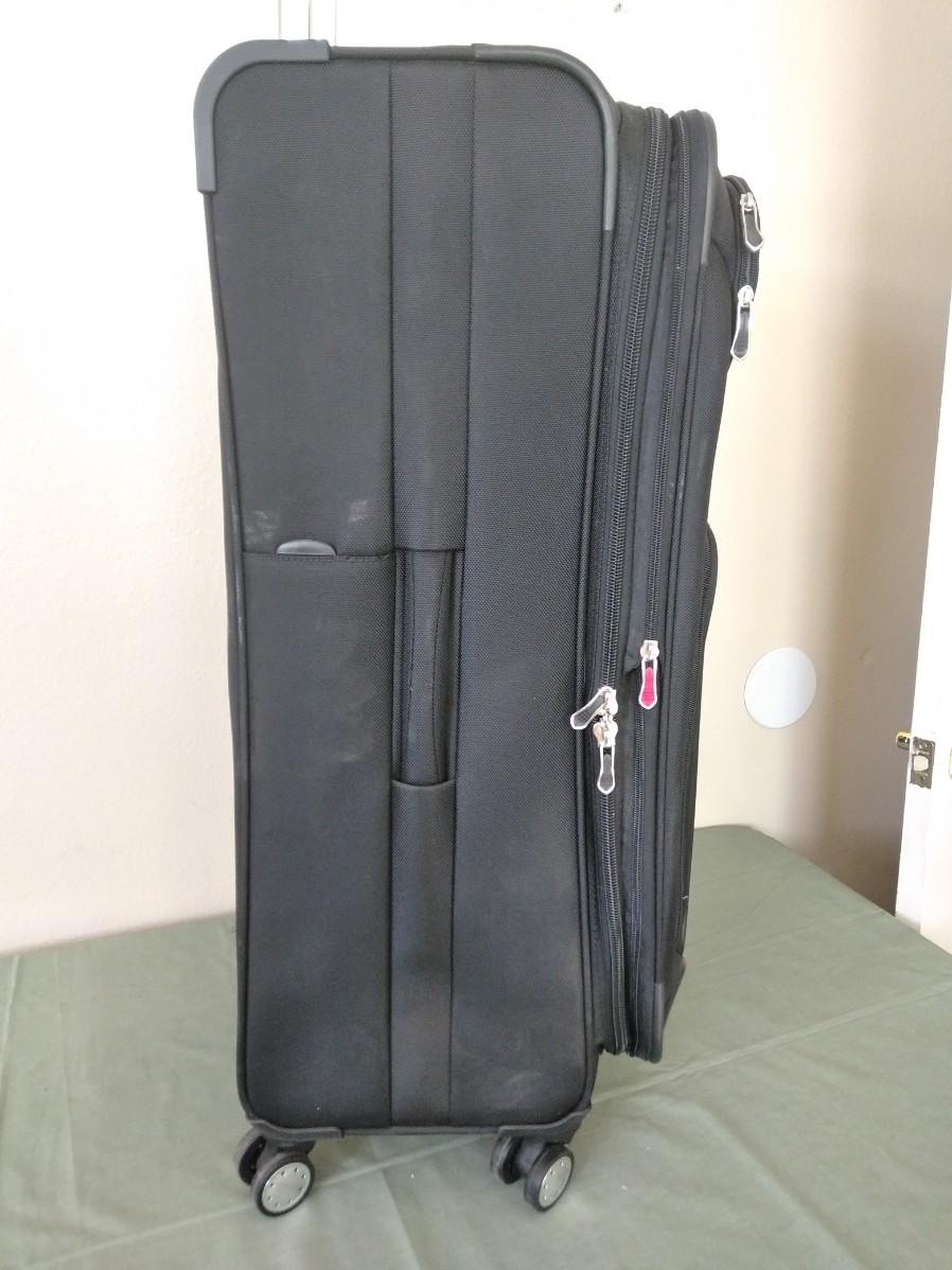 LOT 384 NEW DELSEY LIGHTWEIGHT SUITCASE WITH OVERWEIGHT INDICATOR