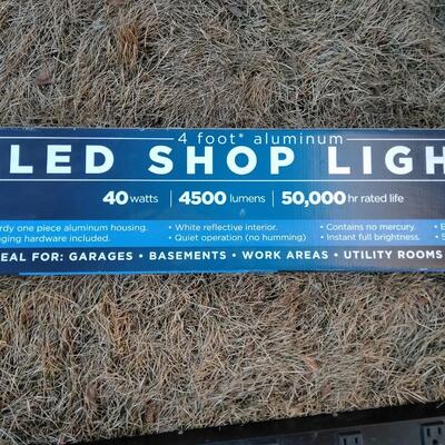LOT 91  NEW LED SHOP LIGHT AND 12 OUTLET POWER STRIP