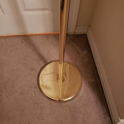 Tall magnifying mirror on stand
