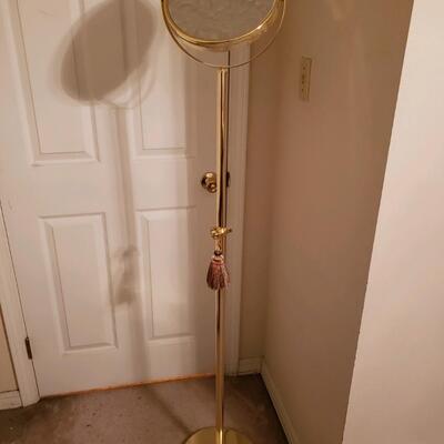 Tall magnifying mirror on stand
