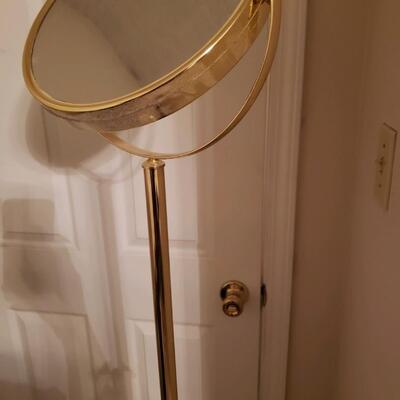 Tall magnifying mirror on stand