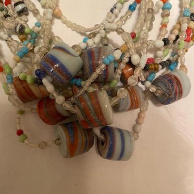 Lot A of one dozen vintage glass Mardi Gras beads
