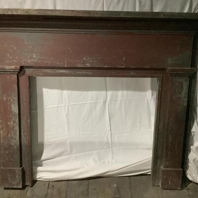Mantel surround -aged wood from the ages with darker red paint