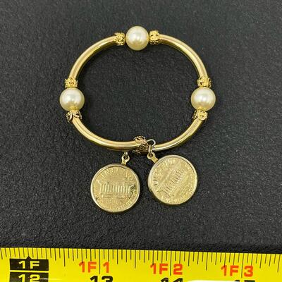 GOLD-TONED BANGLE BRACELET W/ PENNY CHARMS