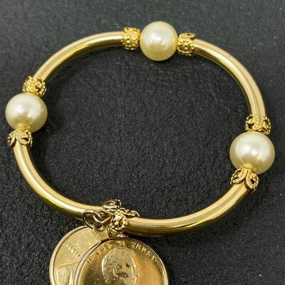 GOLD-TONED BANGLE BRACELET W/ PENNY CHARMS
