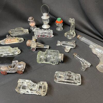 Lot of 16 Antique Glass Candy Jars Shaped Like Cars, Tank, Planes, Boats, Train, Guns, Telephone, and Lanterns
