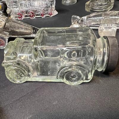 Lot of 16 Antique Glass Candy Jars Shaped Like Cars, Tank, Planes, Boats, Train, Guns, Telephone, and Lanterns