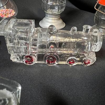 Lot of 16 Antique Glass Candy Jars Shaped Like Cars, Tank, Planes, Boats, Train, Guns, Telephone, and Lanterns