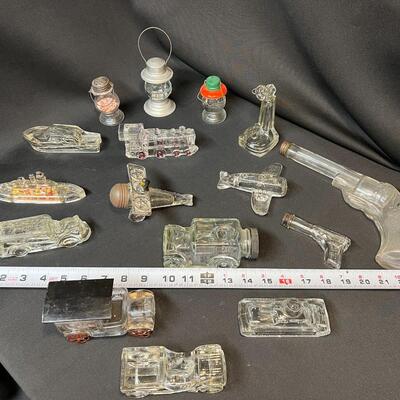 Lot of 16 Antique Glass Candy Jars Shaped Like Cars, Tank, Planes, Boats, Train, Guns, Telephone, and Lanterns