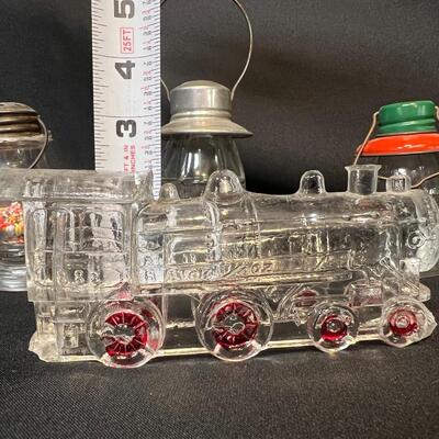 Lot of 16 Antique Glass Candy Jars Shaped Like Cars, Tank, Planes, Boats, Train, Guns, Telephone, and Lanterns