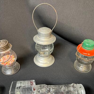 Lot of 16 Antique Glass Candy Jars Shaped Like Cars, Tank, Planes, Boats, Train, Guns, Telephone, and Lanterns