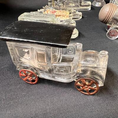 Lot of 16 Antique Glass Candy Jars Shaped Like Cars, Tank, Planes, Boats, Train, Guns, Telephone, and Lanterns