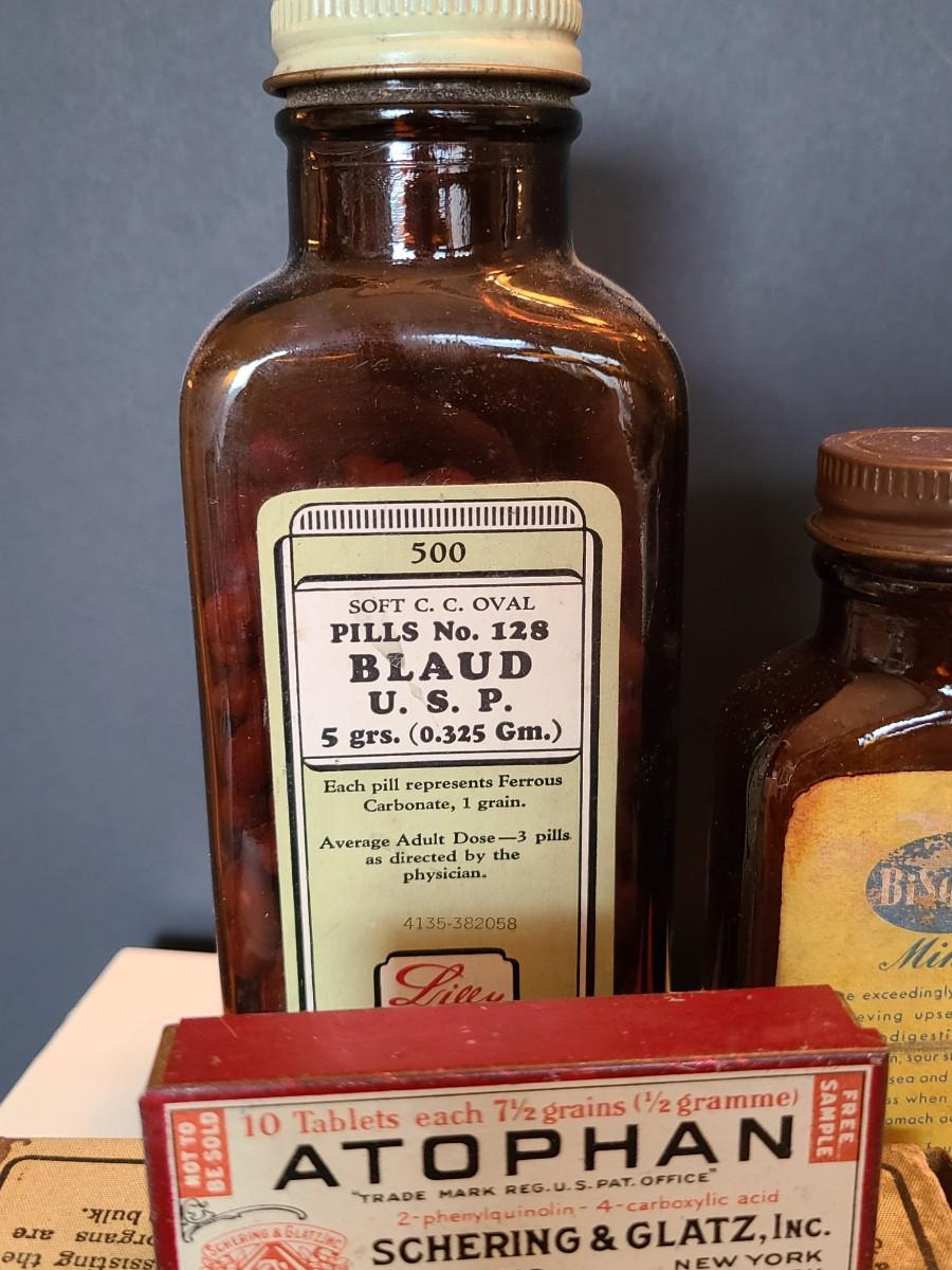 LOT 133: Vintage Apothecary Bottles and Tins EstateSales org