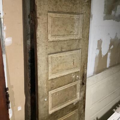2 grayish old doors, 6 panels, old-fashioned door knob