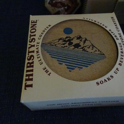 LOT 484. CANDLES AND COASTER SET