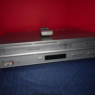 LOT 496.   MEMOREX VHS/DVD PLAYER COMBO AND CLOCK RADIO
