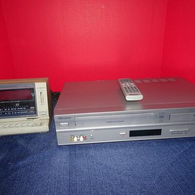 LOT 496.   MEMOREX VHS/DVD PLAYER COMBO AND CLOCK RADIO